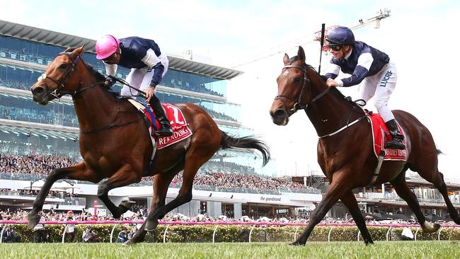 Corey Brown has done it as Rekindling (left) wins our most famous race. Picture: Getty Images