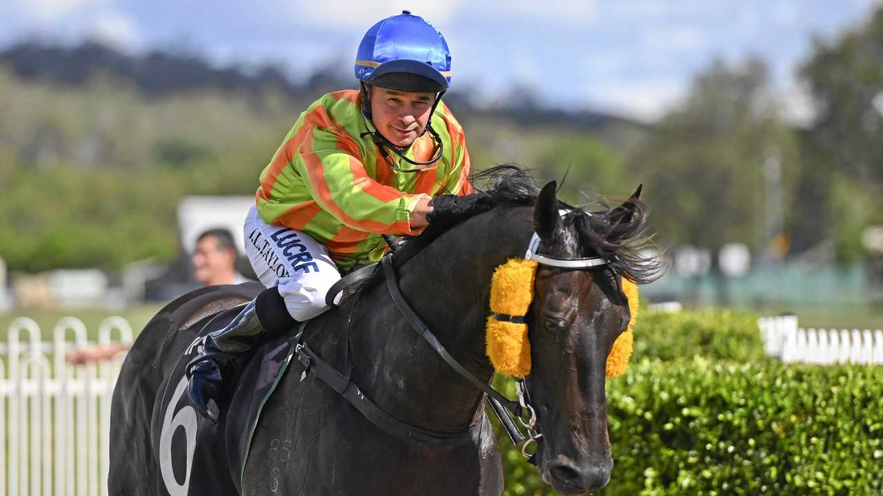 Jockey Jason Taylor relaxes after riding Shauquin to victory at Ipswich racetrack. Picture: Cordell Richardson