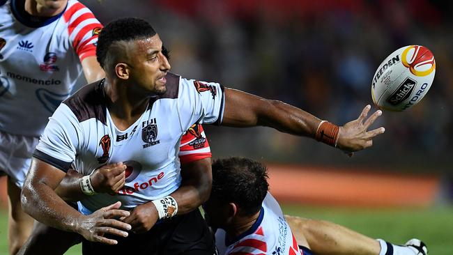 Viliame Kikau gets an offload away for Fiji.