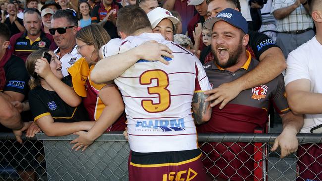 Thirlmere fans celebrate with centre Josh Bryant. Picture: John Appleyard