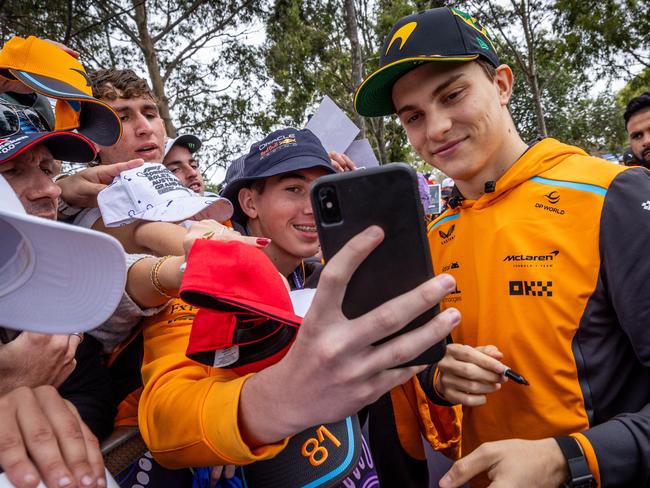 Oscar Piastri signs autographs at last year’s Australian Grand Prix. Picture: Jake Nowakowski