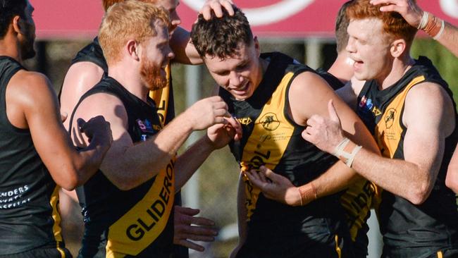 Tiger Brady Searle celebrates his first league goal with teammates against Adelaide at Glenelg Oval on Saturday. Picture: Brenton Edwards