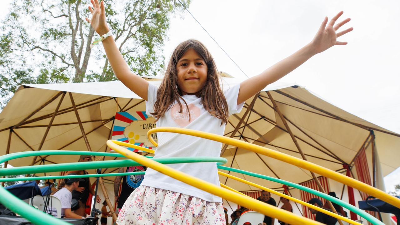 Seven year old Tail Hamama, from Mullumbimby, hula hooping on day one of the Woodford Folk Festival. Picture Lachie Millard