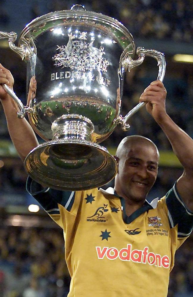 George Gregan lifts the Bledisloe Cup in 2002.