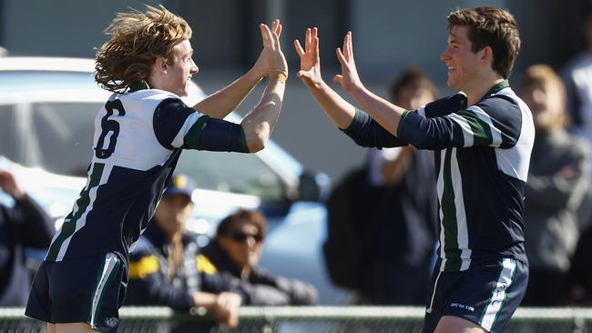 Max Filmer of St Patrick's College (L) celebrates kicking a goal. Picture: Daniel Pockett/AFL Photos/via Getty Images