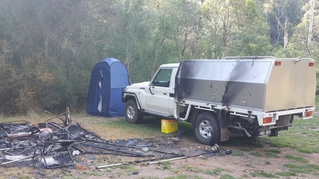Russell Hill and Carol Clay’s burnt out campsite photographed by a camper near Dry River track at Billabong in the Wonnangatta Valley. Picture: ABC