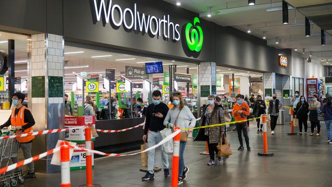 Lines of shoppers seen at Woolworths South Melbourne. Picture: Paul Jeffers