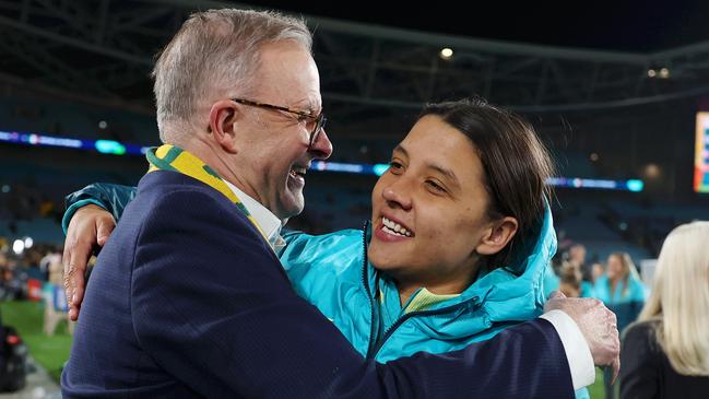 SYDNEY, AUSTRALIA - JULY 20: Sam Kerr of Australia and Anthony Albanese, Prime Minister of Australia, hug after the FIFA Women's World Cup Australia & New Zealand 2023 Group B match between Australia and Ireland at Stadium Australia on July 20, 2023 in Sydney / Gadigal , Australia. (Photo by Mark Metcalfe - FIFA/FIFA via Getty Images)