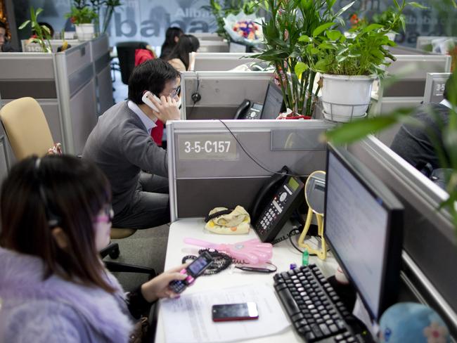 Employees work at Alibaba headquarters. Picture: Nelson Ching/Bloomberg