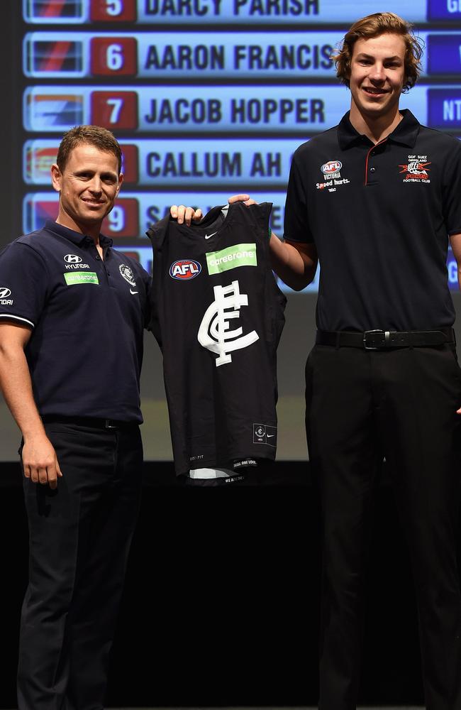 Carlton coach Brendon Bolton presents the club jumper to Harry McKay. Picture: Getty Images