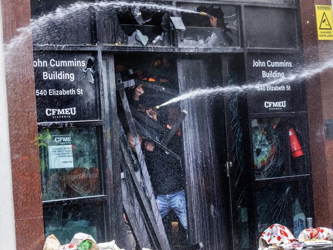 CFMEU members barricade themselves inside their office. Picture: David Geraghty