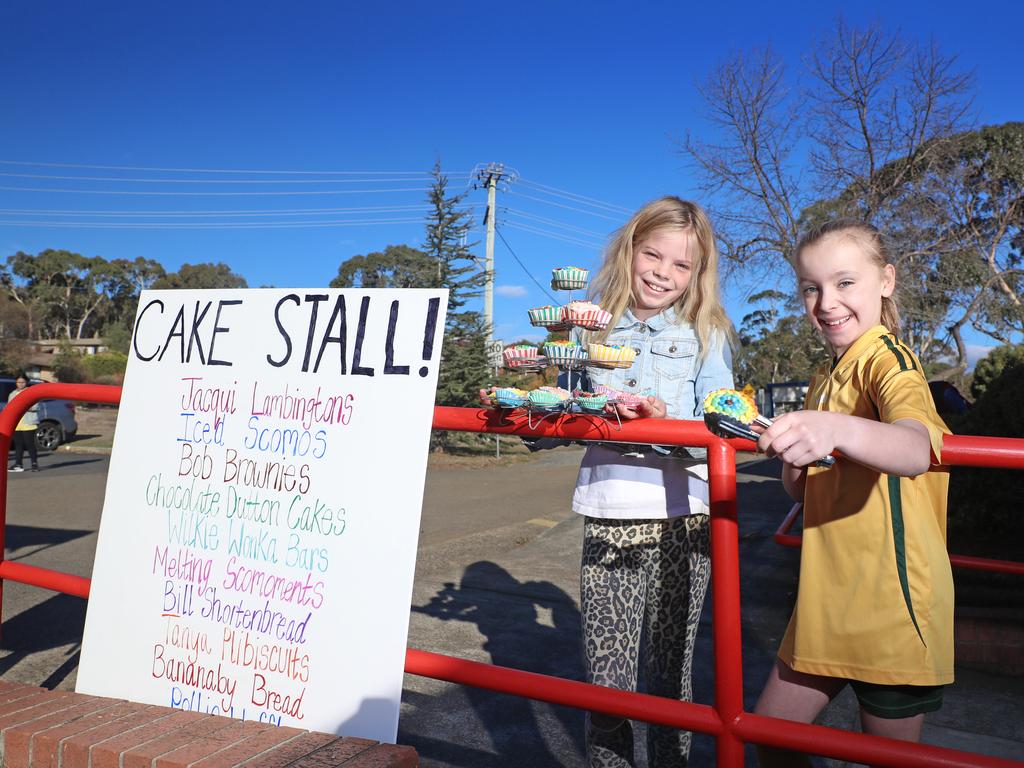 Lucy Bawden and Eleanor Johns both 9 selling cakes at the polling booth at Mount Nelson Picture: LUKE BOWDEN