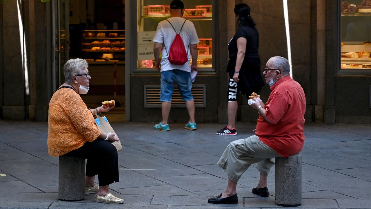 A couple in downtown Madrid on September 16, 2020. Picture: Gabriel Bouys/AFP