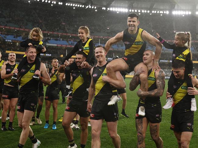 MELBOURNE, AUSTRALIA - JUNE 17: Trent Cotchin of the Tigers is chaired off after he played his 300th game during the round 14 AFL match between Richmond Tigers and St Kilda Saints at Melbourne Cricket Ground, on June 17, 2023, in Melbourne, Australia. (Photo by Robert Cianflone/Getty Images)