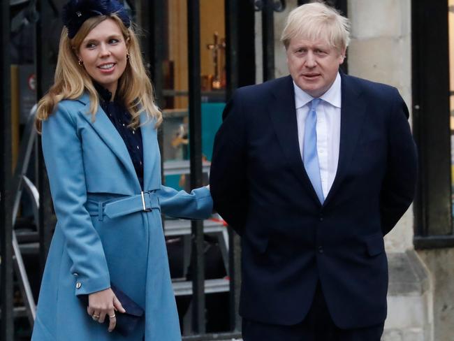 Boris Johnson, pictured with partner Carrie Symonds, is having to rethink the cost of a nanny for their baby boy, Wilfred. Picture: AFP