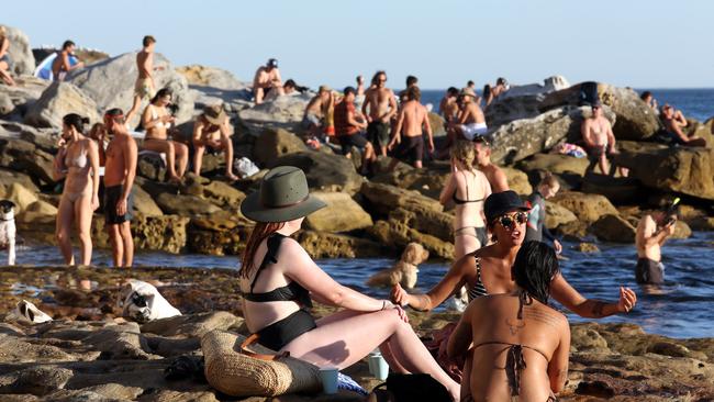 Beachgoers at Bondi Beach on Friday, despite the threat of coronavirus and strict new social distancing guidelines.