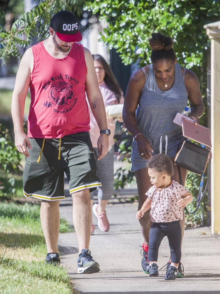 Serena Williams and her husband Alexis Ohanian enjoy an afternoon walk with their 1-year-old daughter Alexia Olympia. Serena's daughter looked seriously cute, toddling her way down the footpath, wearing Nike sneakers like her Mummy. Picture: MediaMode