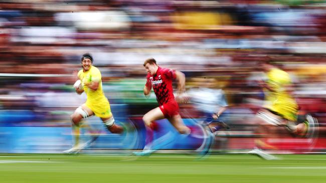 Sam Myers of Australia makes a break against Wales in Hamilton.