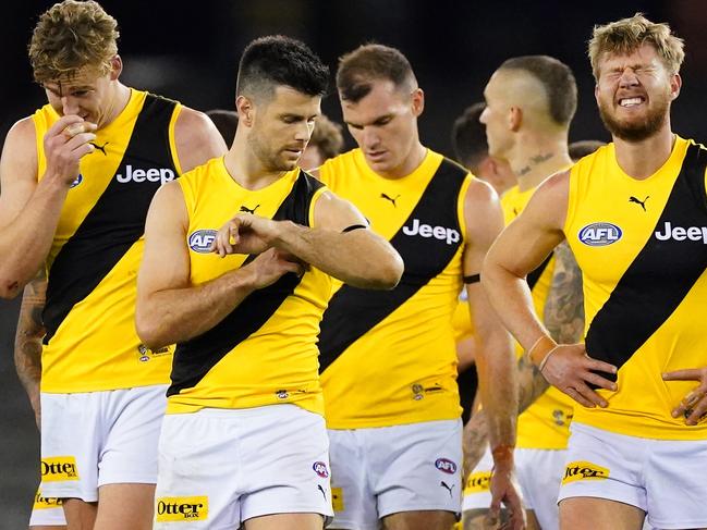 Tom Lynch,Trent Cotchin, Nathan Broad react as they leave the field with their teammates after losing the Round 4 AFL match between the St Kilda Saints and the Richmond Tigers at Marvel Stadium in Melbourne, Saturday, June 27, 2020. (AAP Image/Scott Barbour) NO ARCHIVING, EDITORIAL USE ONLY