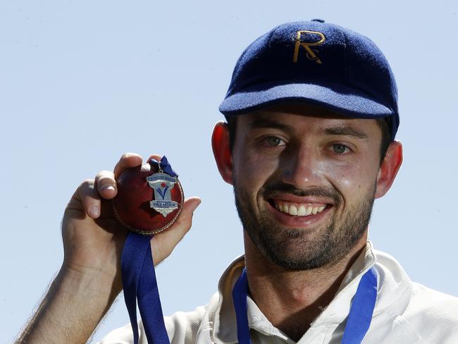 Ian Holland with the John Scholes Medal as the best player in the 2014-15 final. Picture: Yuri Kouzmin