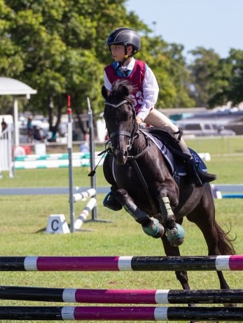 Billy Cooper and Rebel zoom around the 60cm class at the 2023 PQC State Showjumping Championships.