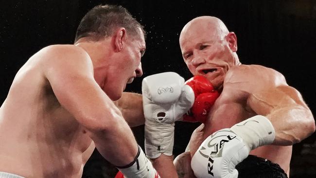 Paul Gallen collects Barry Hall during the Code War Boxing night at Margaret Court Arena in Melbourne in 2019. Picture: AAP