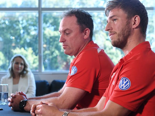 Charlotte Jack watches on as husband Kieren and Swans coach John Longmire announce Jack’s retirement. Picture: Dean Lewins