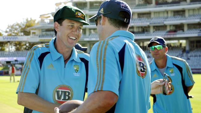 Bryce McGain gets a handshake from Mike Hussey after getting his baggy green.