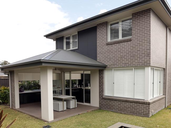 Kempsey 30 Display Home by Rawson Homes at Minto. Exterior Rear