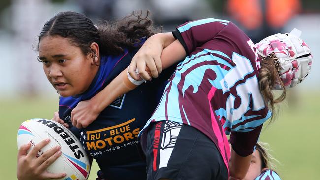 Titans Schools League at Burleigh Bears Junior Rugby League. Year 7/8 Division 1 girls:Keebra Park v Mabel Park . Mabel Parks Rangimaria Hurae-Poi brushes off Keebras Jyanti Kingi. Picture Glenn Hampson