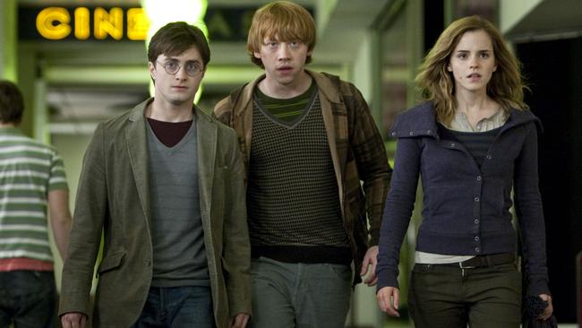 Daniel Radcliffe, left, with Harry Potter co-stars Rupert Grint and Emma Watson in The Deathly Hallows Part 1.