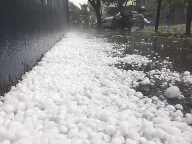 Huge hail stones pile up in Surry Hills last night. Picture: David Matthews