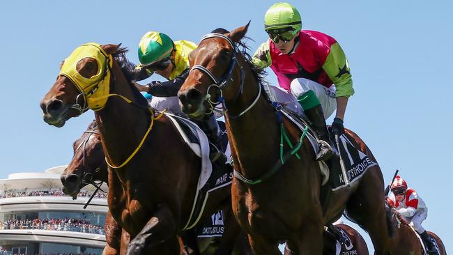 Robbie Dolan on Knight’s Choice (green cap) fights out the finish with Warp Speed, ridden by Akira Sugawara. Picture: Michael Klein