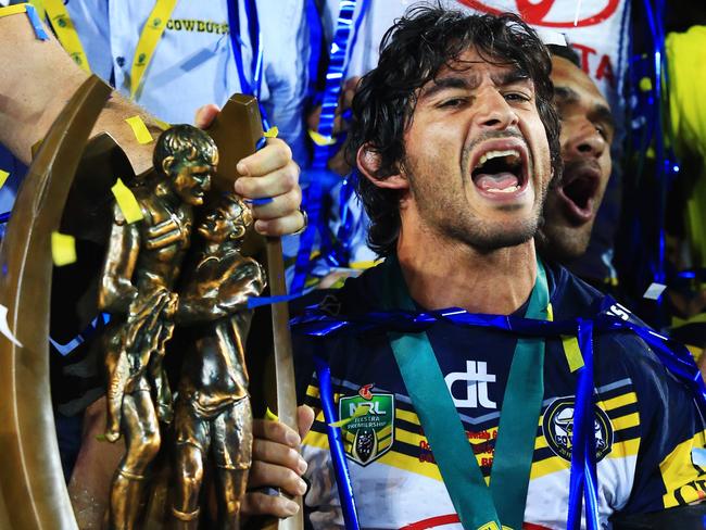 Johnathan Thurston of the Cowboys with the NRL Premiership trophy after their win during the NRL Grand Final between the Brisbane Broncos and the North Queensland Cowboys at ANZ Stadium, Homebush. pic Mark Evans