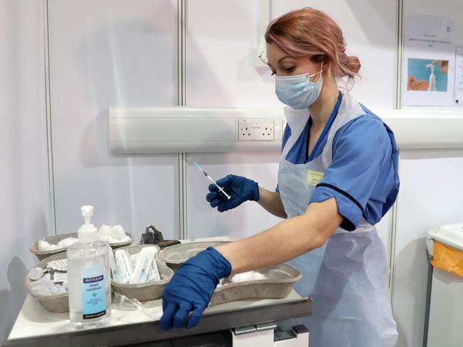 Vaccinator Nicole Clark prepares to administer a COVID-19 vaccine in the UK. Picture: AFP