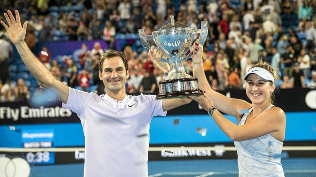 Roger Federer and Belinda Bencic of Switzerland celebrate their finals win at the Hopman Cup. Picture: Tony McDonough