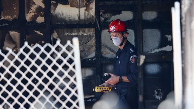 A fire investigator on the scene after three people died in a suspicious house fire in Toowoomba. Picture: Tertius Pickard
