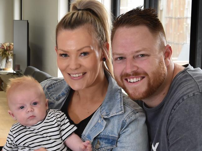 Dylan McGibbin, 29, wife Hayley, 28 and 11-week-old son Jett are focused on building up a rainy day savings account. They recently refinanced their home loan to save money too. Picture: Tony Gough