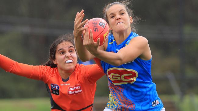 Gold Coast’s Sally Riley marks in the wet conditions. Picture: Getty Images