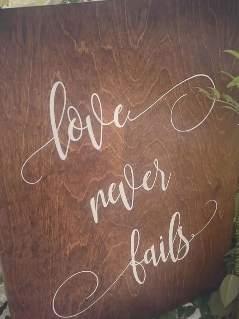 ‘Love never fails,’ one wooden board read.