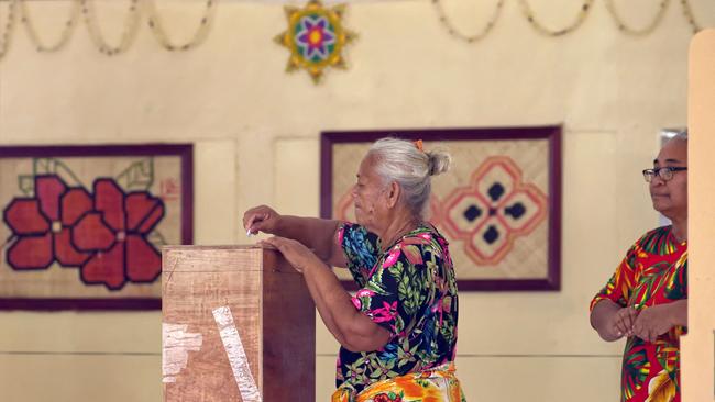 A Tuvaluan woman places her vote into a ballot box on election day in Tuvalu’s capital Funafuti. Picture: AFP