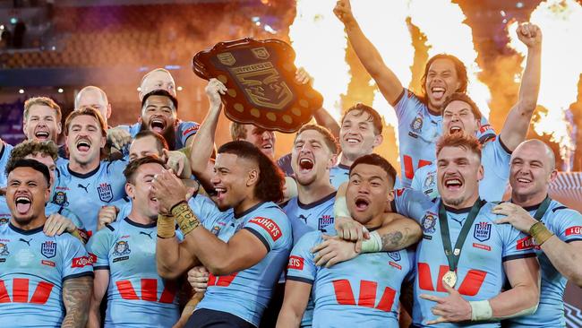 The NSW Blues celebrate after winning game 3 of the State of Origin at Suncorp Stadium. Picture by Luke Marsden.