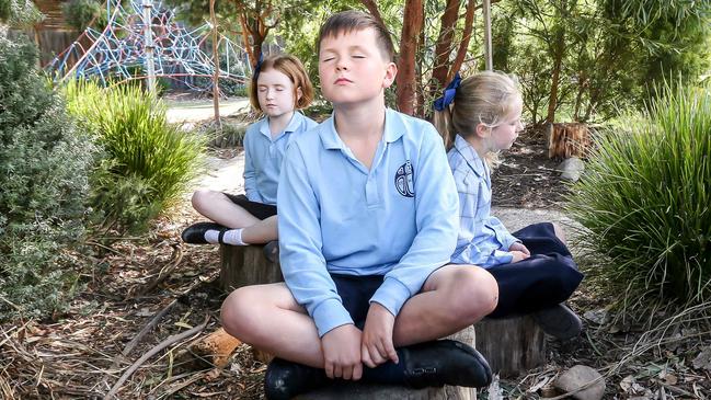 Tess, Spencer and Florence meditate. Picture: Tim Carrafa