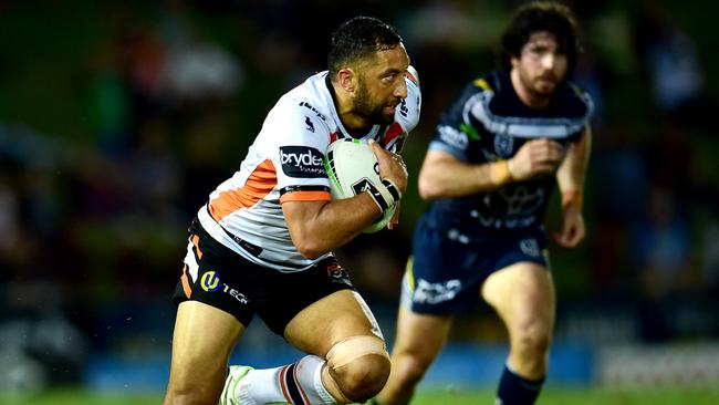 Benji Marshall slips Jake Clifford's grips . NRL; North Queensland Cowboys Vs West Tigers at 1300Smiles Stadium. Picture: Alix Sweeney