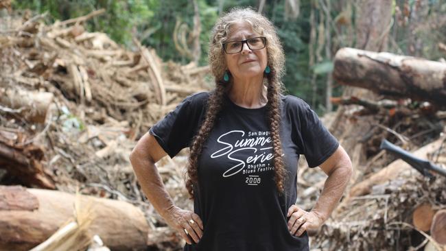 Awestruck Cape Tribulation resident Zoe Photellis inspects damage caused by ex-Tropical Cyclone Jasper and subsequent floods at Rykers Creek earlier this week. Ms Photellis, who lives nearby, visited the site for the first time on Wednesday, more than seven weeks after the wettest tropical cyclone in Australian history crossed the Queensland coast. The Bureau of Meteorology recorded more than 2,200mm of rain in the week ex-TC Jasper made landfall with residents still cleaning up from the record rain event and subsequent floods.