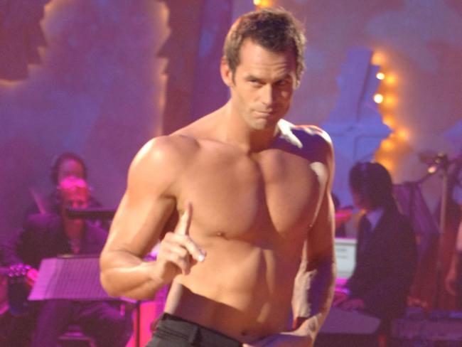 A bare-chested Tom Williams as he competes in grand final of TV show Dancing With the Stars, with dancer Kym Johnson.