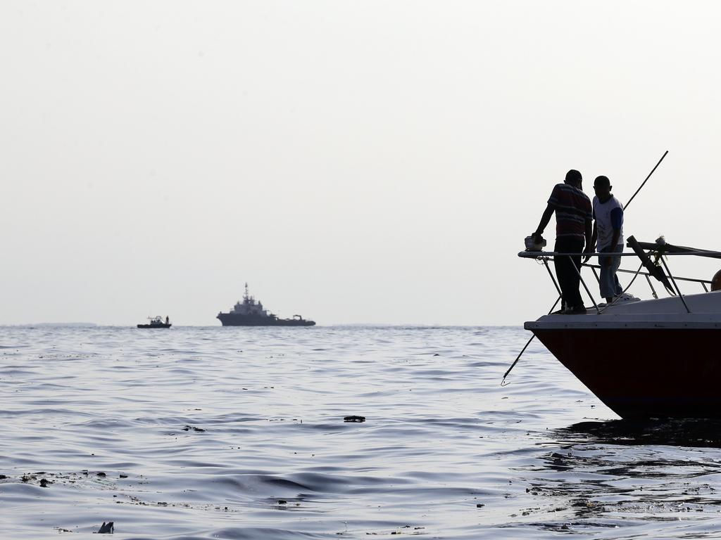 Rescuers search for victims. Picture: AP/Achmad Ibrahim