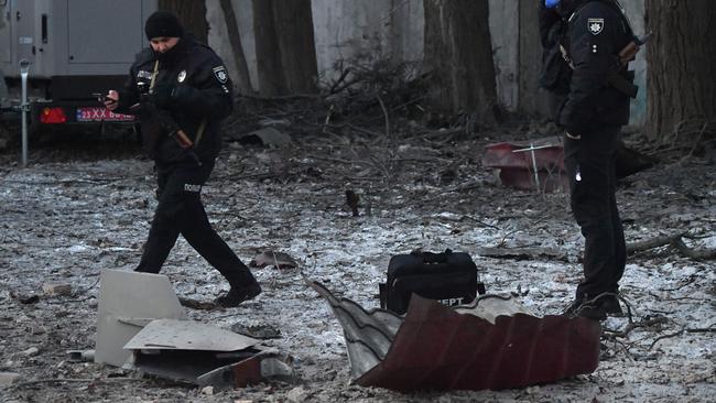 A civil defence member examine the remains of an Iranian-made Kamikaze drone in Kyiv earlier this month. Picture: AFP