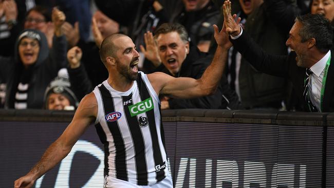 High five for Steele Sidebottom and the Pies, who will be back on the Friday night broadwa in 2019. Picture: AAP