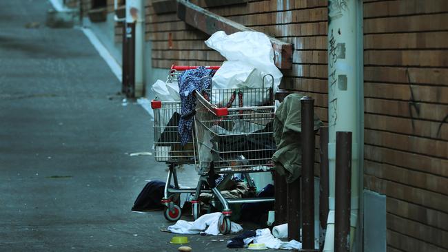 A homeless person sleeps under a trolley in a Southport alleyway. Picture: Glenn Hampson